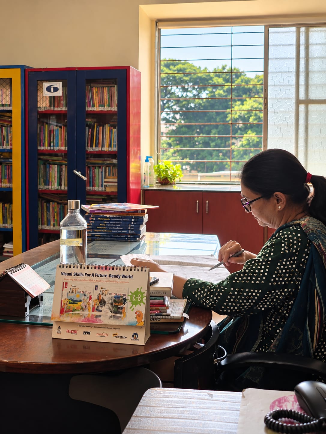 A North Point School staff member working in the library