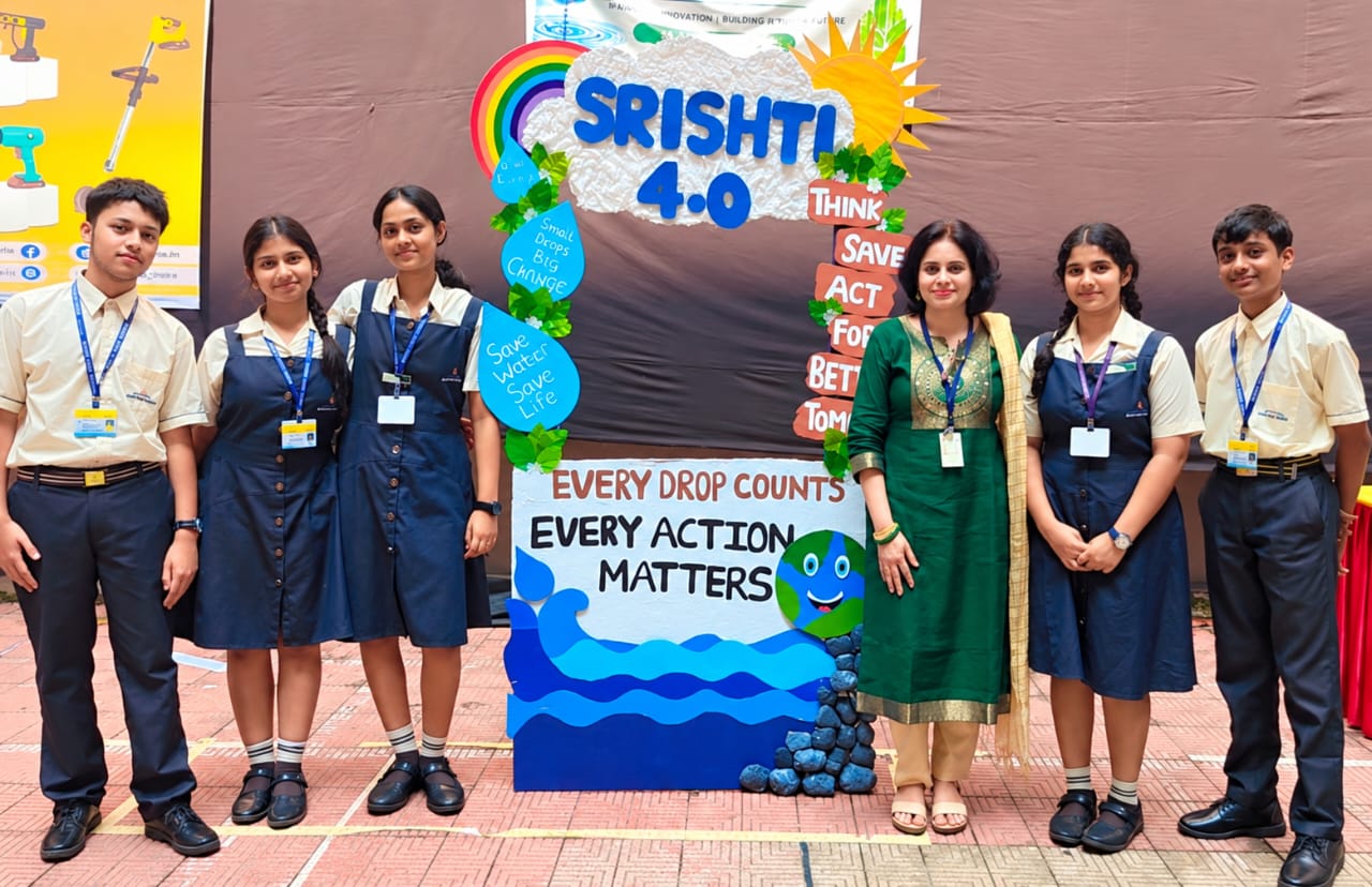 North Point students and their teacher beside the SRISHTI 4.0 water conservation exhibition display